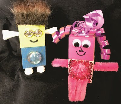 Two handmade block toy characters.