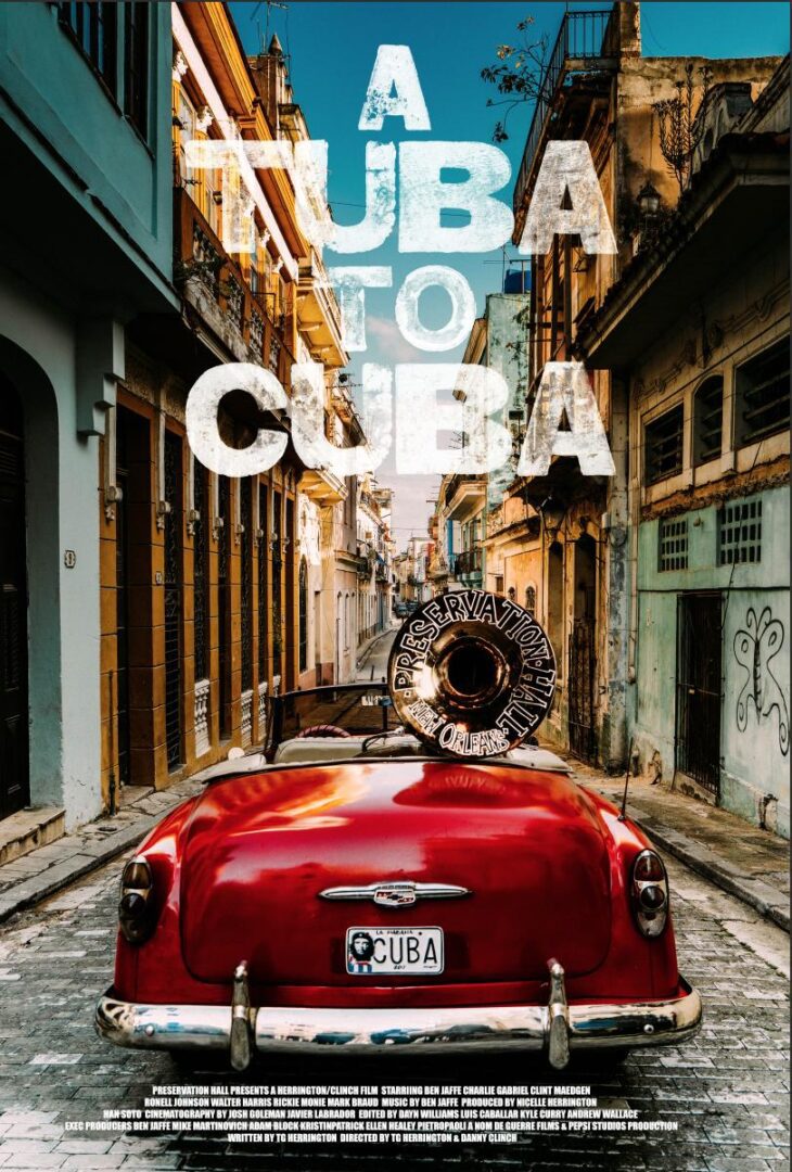 Red convertible with tuba in Cuba.